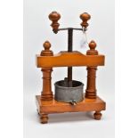 A 19TH CENTURY FRUITWOOD TABLE TOP FRUIT PRESS