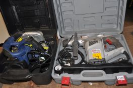 A CASED PERFORMANCE 1050W ROTARY HAMMER DRILL and a Challenge Extreme 240v Circular Saw (both PAT