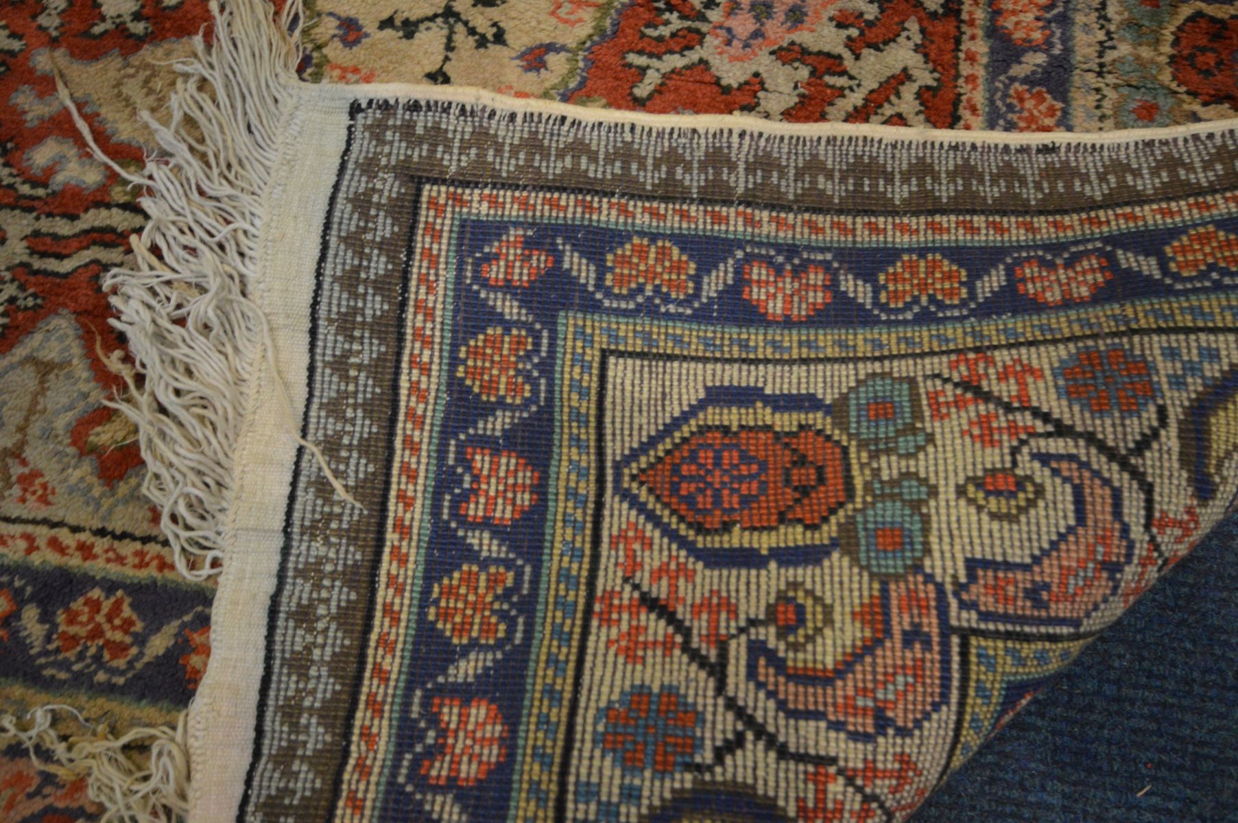 A SILK AND COTTON KAYSERI RUG, 137cm x 92cm, a similar red rug, and another rug (3) - Image 4 of 5