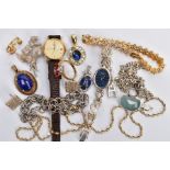 A SELECTION OF JEWELLERY, to include two lapis lazuli oval pendants, a flower brooch, a twist