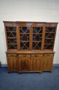 A MAHOGANY BREAKFRONT BOOKCASE, four door glazed top section, four drawers and four cupboard