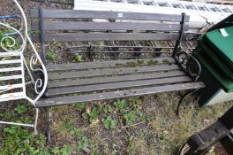 A GARDEN BENCH with cast iron scrolled ends and hardwood slatted seat and back, width 123cm (sd to