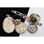 SIX ITEMS, to include a operculum shell ring, an oval silver pendant, a George IV 2 shilling south