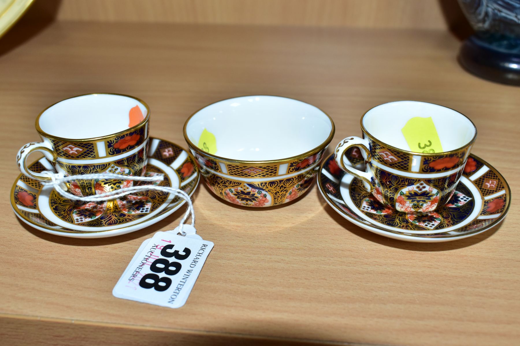 ROYAL CROWN DERBY MINIATURE TEAWARES, '1128' pattern, comprising of two tea cups both XLVII, one