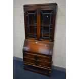 AN EARLY 20TH CENTURY OAK LEAD GLAZED BUREAU BOOKCASE, width 89cm x depth 42cm x height 200cm