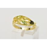 A MODERN 18CT GOLD GEM SET DRESS RING, three marquise cut green gemstones claw set to a foliate open