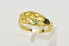 A MODERN 18CT GOLD GEM SET DRESS RING, three marquise cut green gemstones claw set to a foliate open