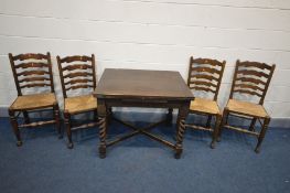 An EARLY 20TH CENTURY FOLD OVER DINING TABLE, on barley twist supports united by a cross