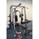 A BODYMAX CF380 SMITH MACHINE MULTI GYM with eighteen weight in pairs from 25kg to 2.5kgs and thirty