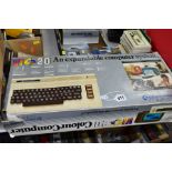 A BOXED COMMODORE VIC 20 COLOUR COMPUTER AND A BOX OF RETRO COMPUTER ACCESSORIES, the Vic 20 box