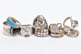 NINE RINGS, to include an inlaid mother of pearl ring, a skull ring, a Claddagh ring etc., many with