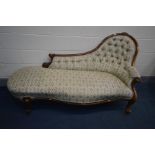 A VICTORIAN MAHOGANY CHAISE LONGUE, with floral upholstery, scrolled arms, cabriole legs on brass