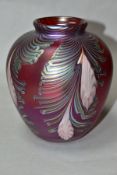 RICHARD P GOLDING FOR OKRA GLASS VASE, of bulbous form, Peacock feather design on pink, iridescent