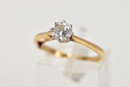 A DIAMOND SINGLE STONE RING. A modern round brilliant cut diamond claw set to knife edge shoulders