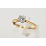 A DIAMOND SINGLE STONE RING. A modern round brilliant cut diamond claw set to knife edge shoulders