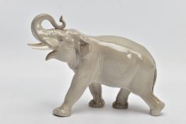 A MID 20TH CENTURY RUSSIAN CERAMIC MODEL OF A BULL ELEPHANT, grey gloss, red printed mark, height