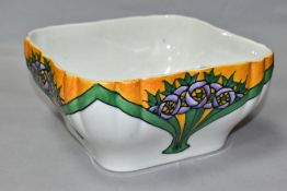 A MINTON LTD SECESSIONIST SQUARE BOWL, decorated with stylized purple flowers, with ochre and