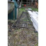 A VINTAGE STEEL DOUBLE EXTENSION LADDER with flared feet close length 3m (some repairs)