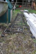 A VINTAGE STEEL DOUBLE EXTENSION LADDER with flared feet close length 3m (some repairs)