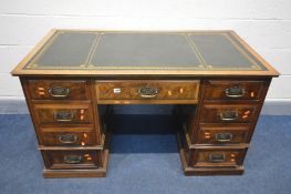 AN EDWARDIAN WALNUT AND BURR WALNUT KNEE HOLE DESK, green leather and gilt tooled inlay top, and