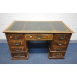 AN EDWARDIAN WALNUT AND BURR WALNUT KNEE HOLE DESK, green leather and gilt tooled inlay top, and