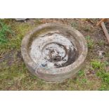 A CIRULAR COMPOSITE SINK/WATER TROUGH, 60cm in diameter 17cm high