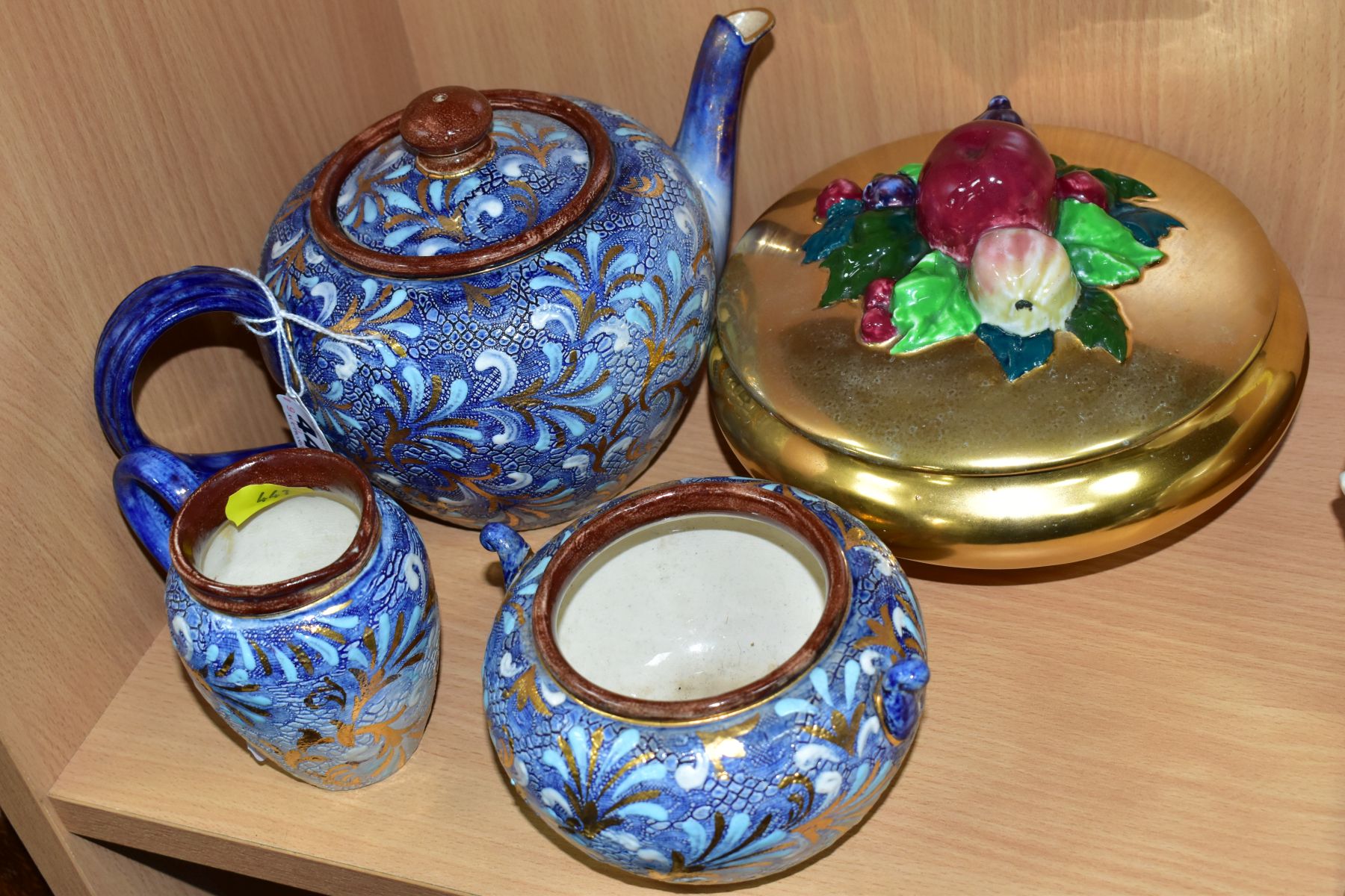 A THREE PIECE DOULTON LAMBETH SLATERS PATENT TEA SERVICE, gilt and blue decoration on blue ground,