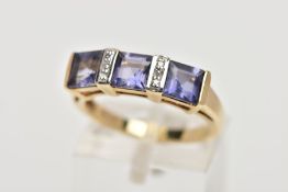 A MODERN 9CT GOLD TANZANITE AND DIAMOND DRESS RING, three square cut tanzanite's each measuring