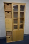 A MODERN BEECH GLAZED TWO DOOR BOOKCASE above a single cupboard door, width 72cm x depth 40cm x