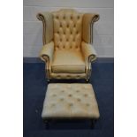 A TAN LEATHER BUTTON BACK WING BACK ARMCHAIR on cabriole legs, inner width 48cm x outer width 82cm