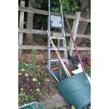 AN ALUMINIUM STEP LADDER, height 160cm and a selection of garden tools including a wheeled refuse