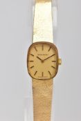 A 9CT GOLD LADY'S RENET WRISTWATCH. A cushion shape case measuring approximately 21.0mm x 18mm,