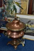 A COPPER SAMOVAR, with twin handles, brass front pouring tap, on four footed square base,