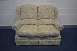 A FLORAL UPHOLSTERED SOFA, length 140cm