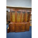 A MAHOGANY BREAKFRONT FOUR DOOR BOOKCASE, with a single secretaire drawer, width 182cm x depth