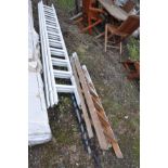 A VINTAGE WOODEN STEP LADDER height 141cm and a wooden triple extension ladder with eleven rungs