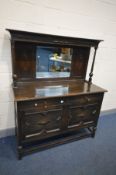 AN EARLY 20TH CENTURY OAK GEOMETRIC MIRRORBACK SIDEBOARD, with drawers, width 134cm x depth 58cm x