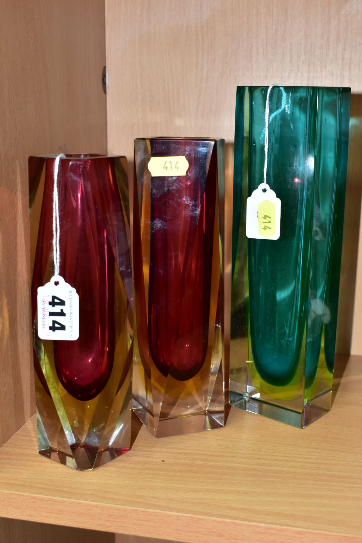 THREE MURANO CASED GLASS VASES, comprising two geometric vases with clear and yellow over red, one