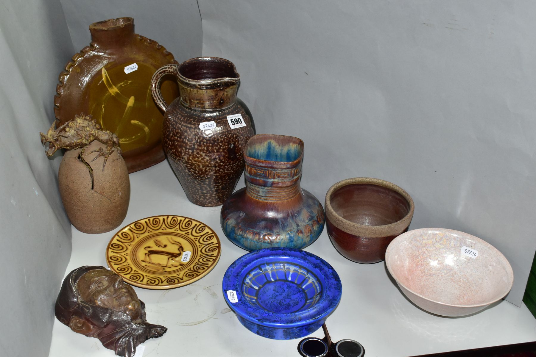 A GROUP OF DECORATIVE POTTERY, comprising a Bladon Pottery Dragon and egg sculpture, Jaffe Rose