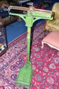 A SET OF BARTLETT & SON BRISTOL FLOORSTANDING WEIGHING SCALES, green painted, height 120cm