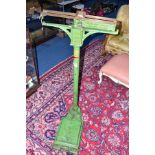 A SET OF BARTLETT & SON BRISTOL FLOORSTANDING WEIGHING SCALES, green painted, height 120cm