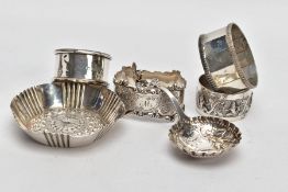 SIX ITEMS OF SILVERWARE, to include four single napkin rings, a decorative trinket bowl and a