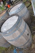 A PAIR OF MODERN OAK BARRELS with galvanised banding height 88cm and 60cm diameter at top and bottom