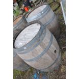 A PAIR OF MODERN OAK BARRELS with galvanised banding height 88cm and 60cm diameter at top and bottom