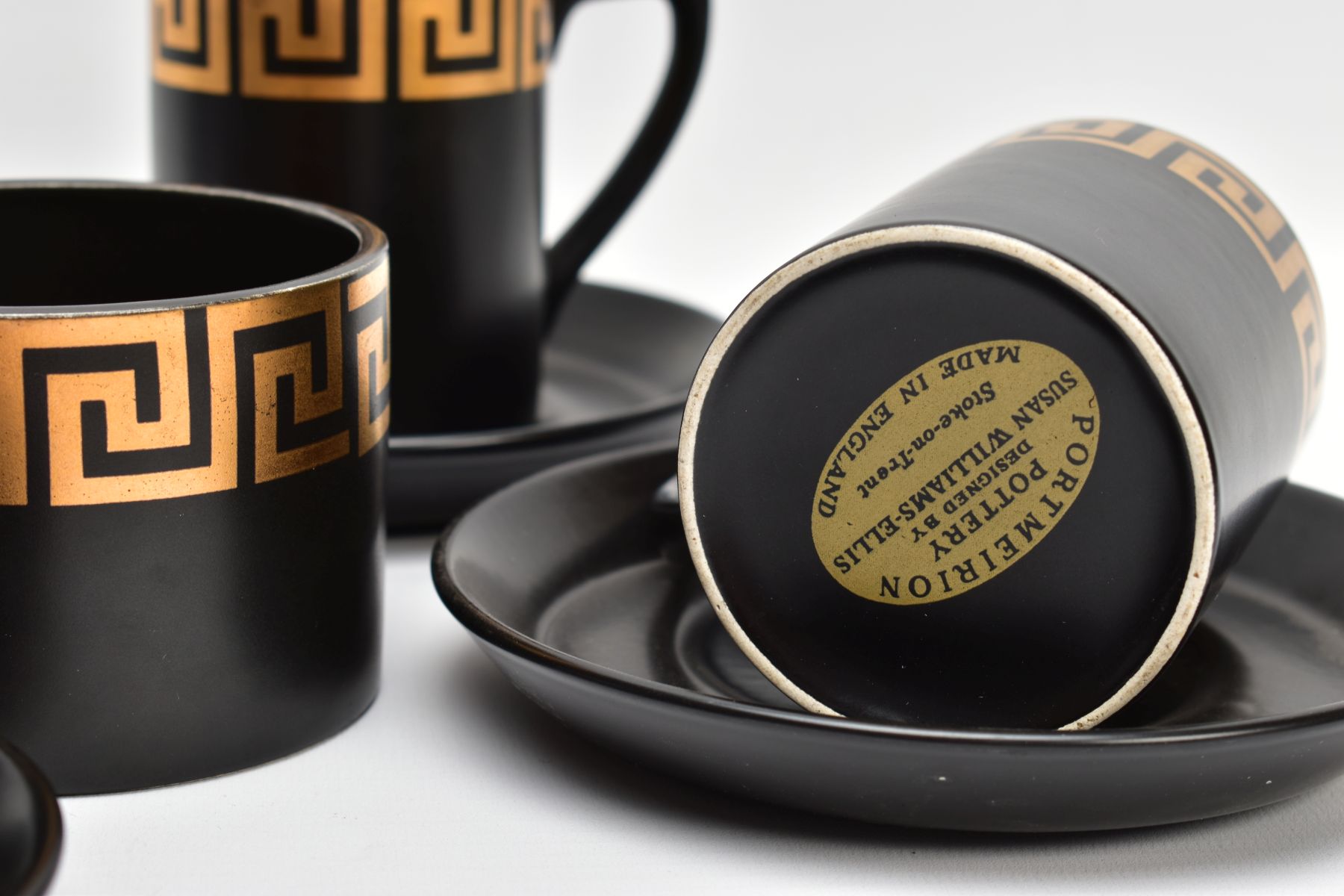 A PORTMEIRION COFFEE SET by Susan Williams-Ellis with gilt Greek key border decoration, on a black - Image 3 of 7