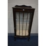 AN EARLY 20TH CENTURY MAHOGANY SINGLE DOOR CHINA CABINET, with two glass shelves, on ball and claw