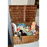 A WICKER BASKET CONTAINING A COLLECTION OF TY BEANIE BABIES, majority complete with tag and label