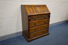 AN OAK OLD CHARM BUREAU, linenfold fall front above four long drawers, width 75cm x depth 48cm x