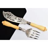 A VICTORIAN SILVER AND IVORY HANDLED FISH KNIFE AND FORK SERVERS, pierced detailed blades, with an
