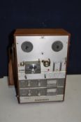 A VINTAGE AKAI M-9 REEL TO REEL PLAYER in a walnut veneer case and lid, Serial No 38139 ( PAT pass